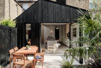 Black Timber, Bold Concrete: A Striking Kitchen Extension