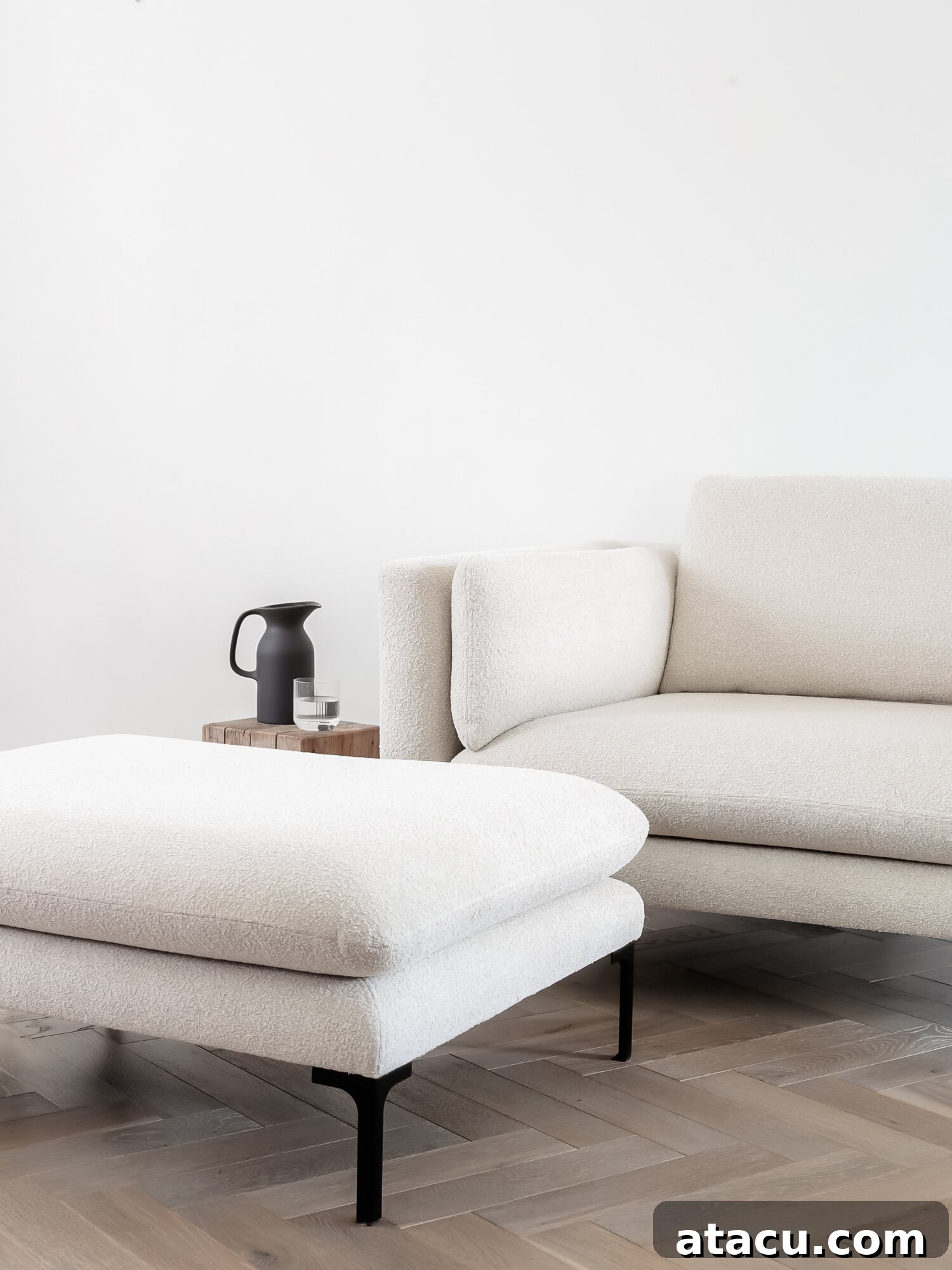 Douglas low arm armchair in a minimalist setting