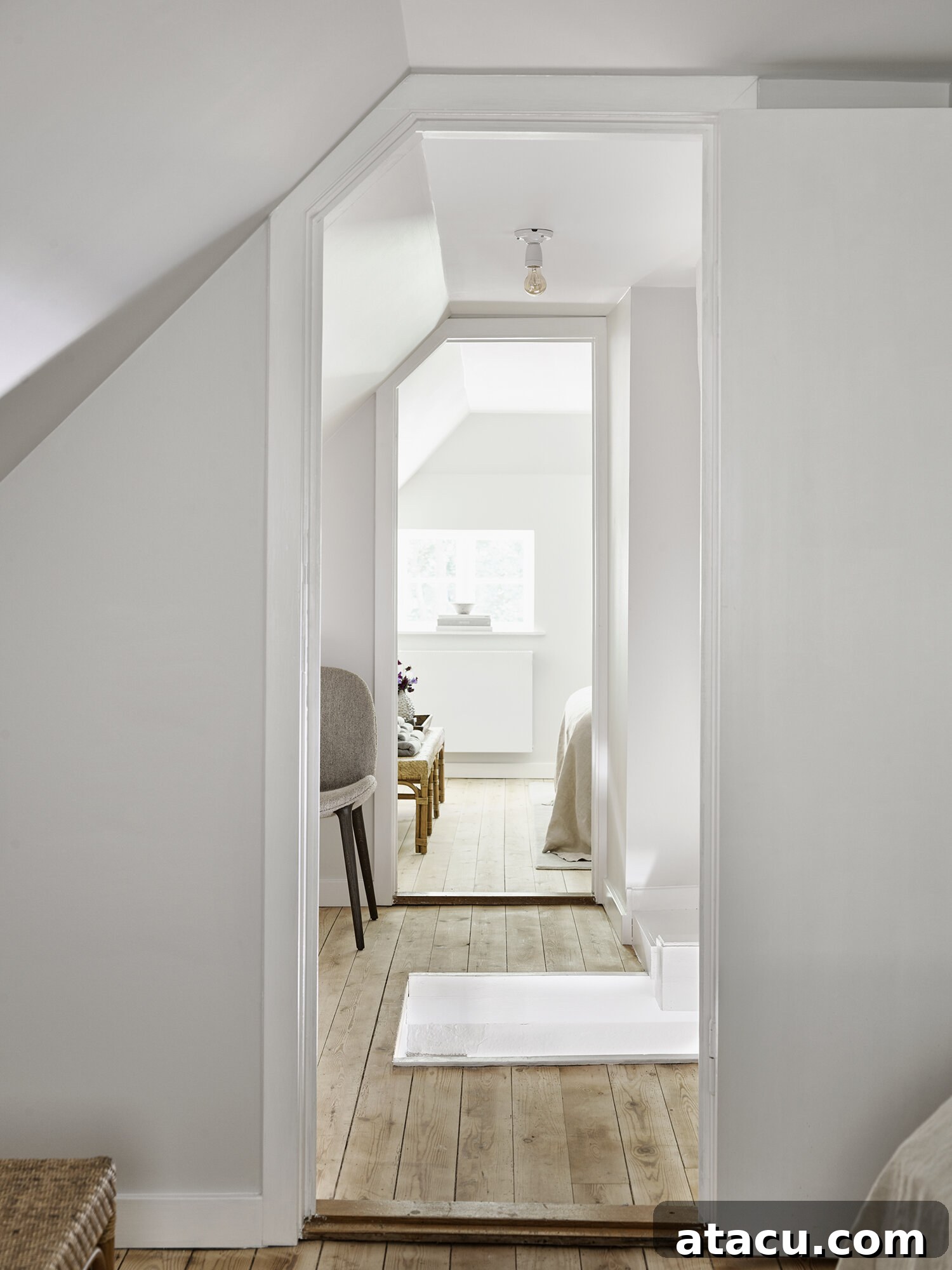 Vipp Farmhouse corridor with elegant lighting and warm wooden floor leading to bedrooms