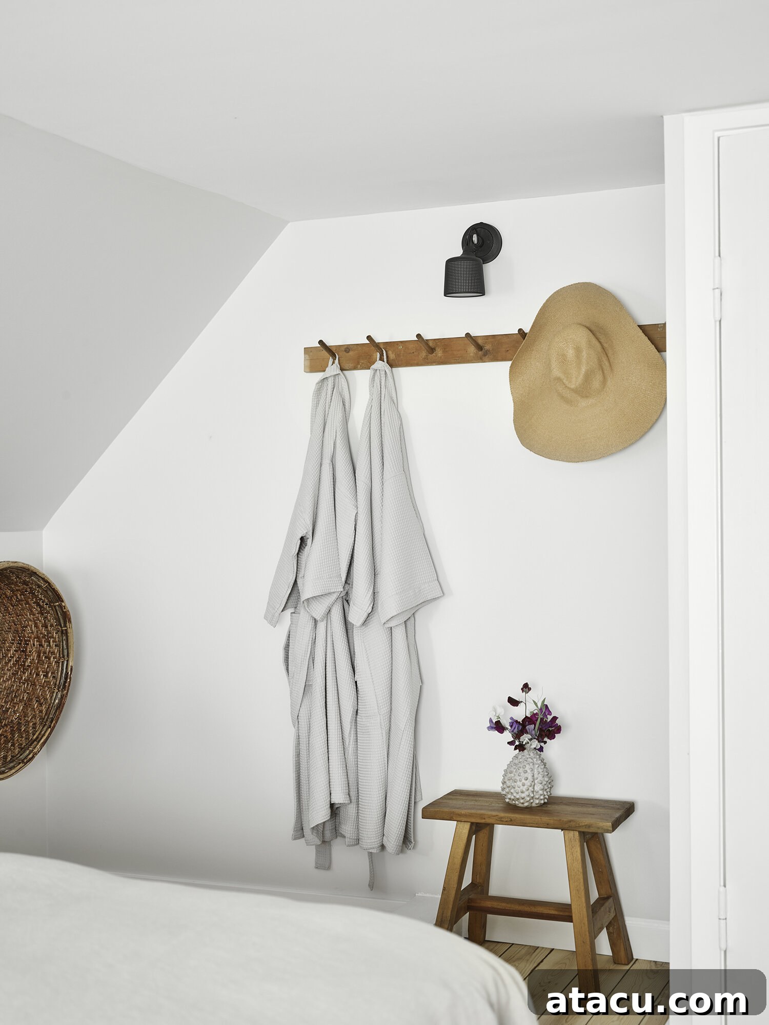 Vipp Farmhouse stylish bedroom with natural light streaming through a large window