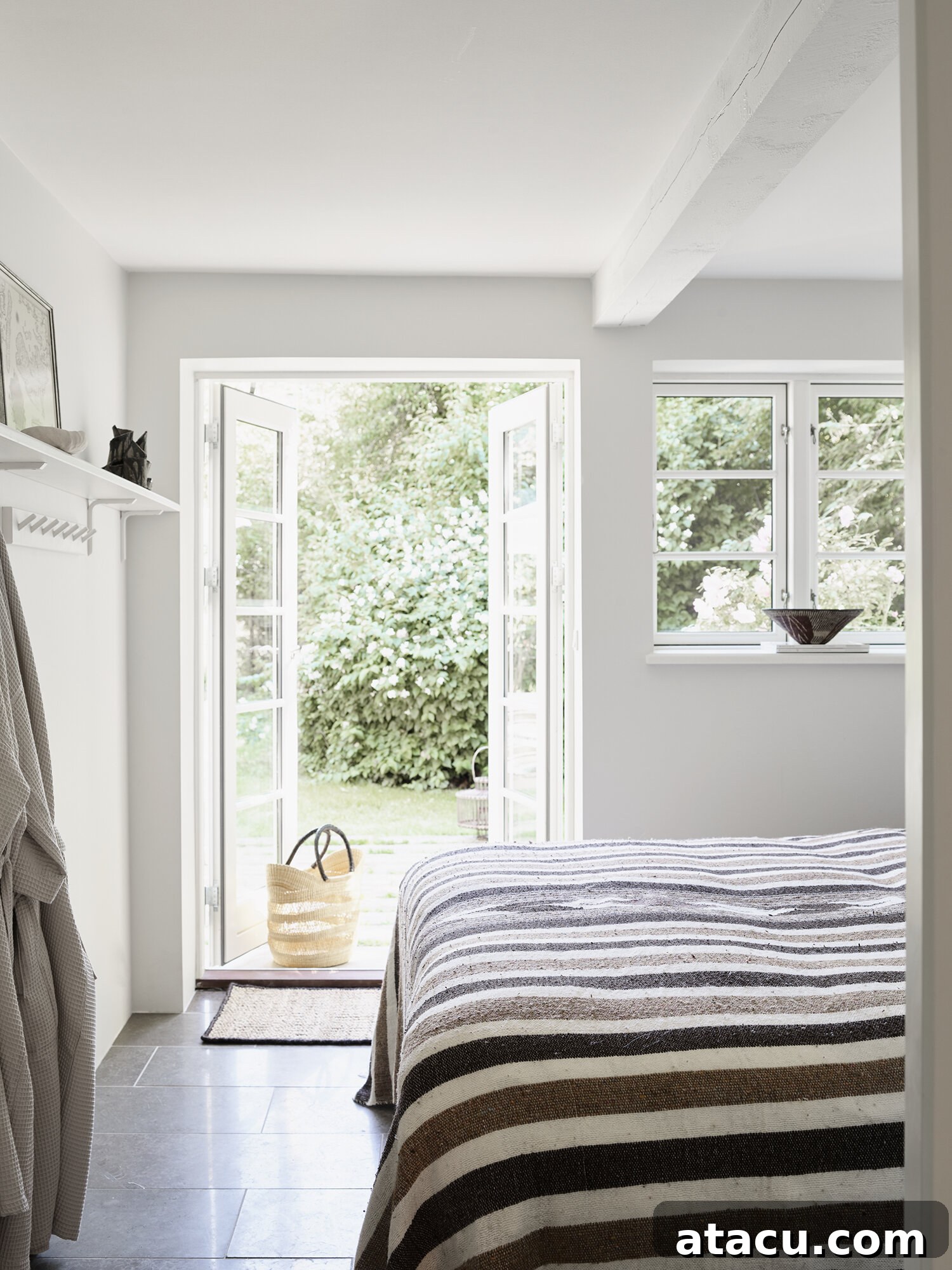 Vipp Farmhouse minimalist bedroom with a view of the serene forest landscape