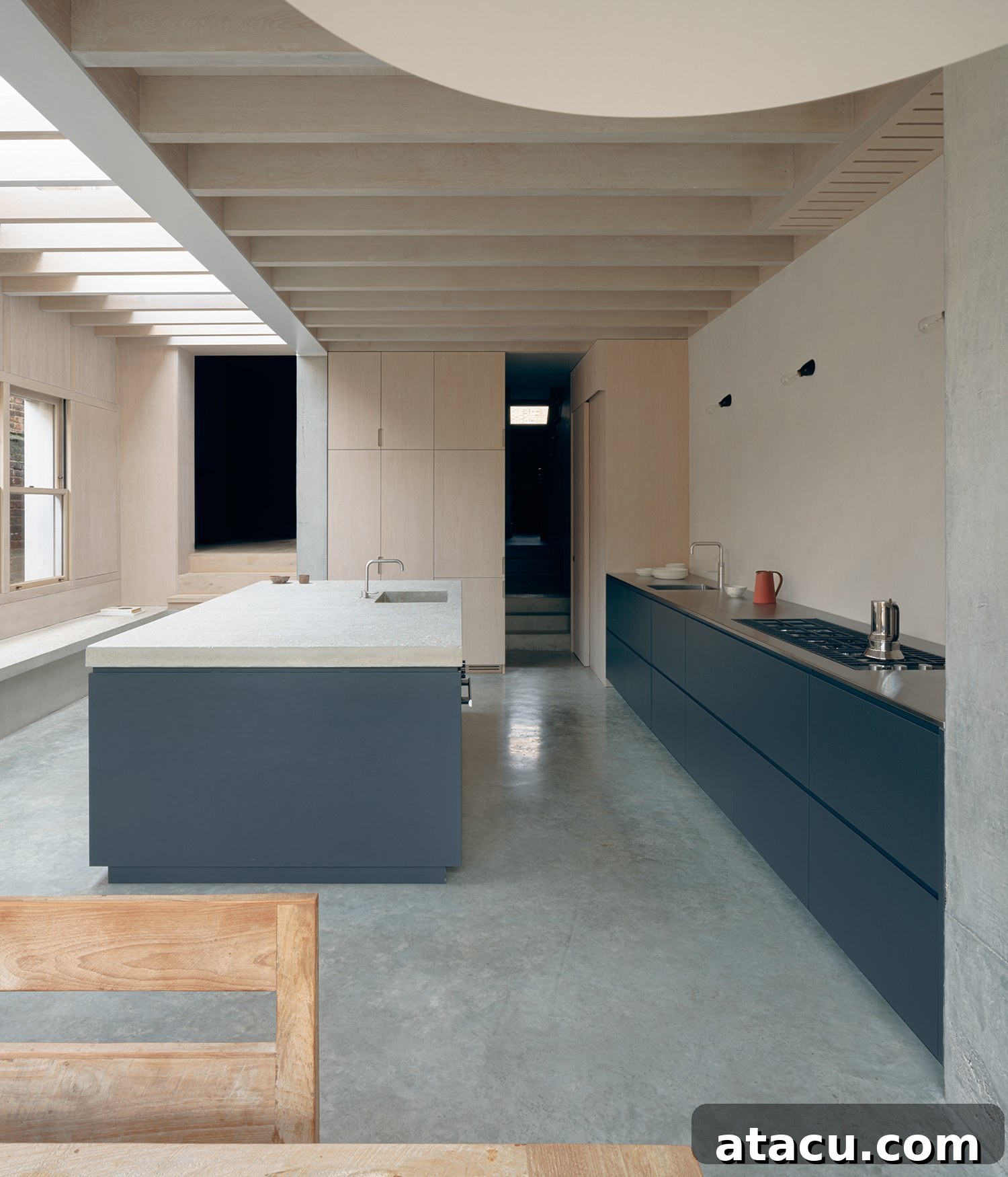 Exterior view of Concrete Plinth House showing the modern light-filled extension