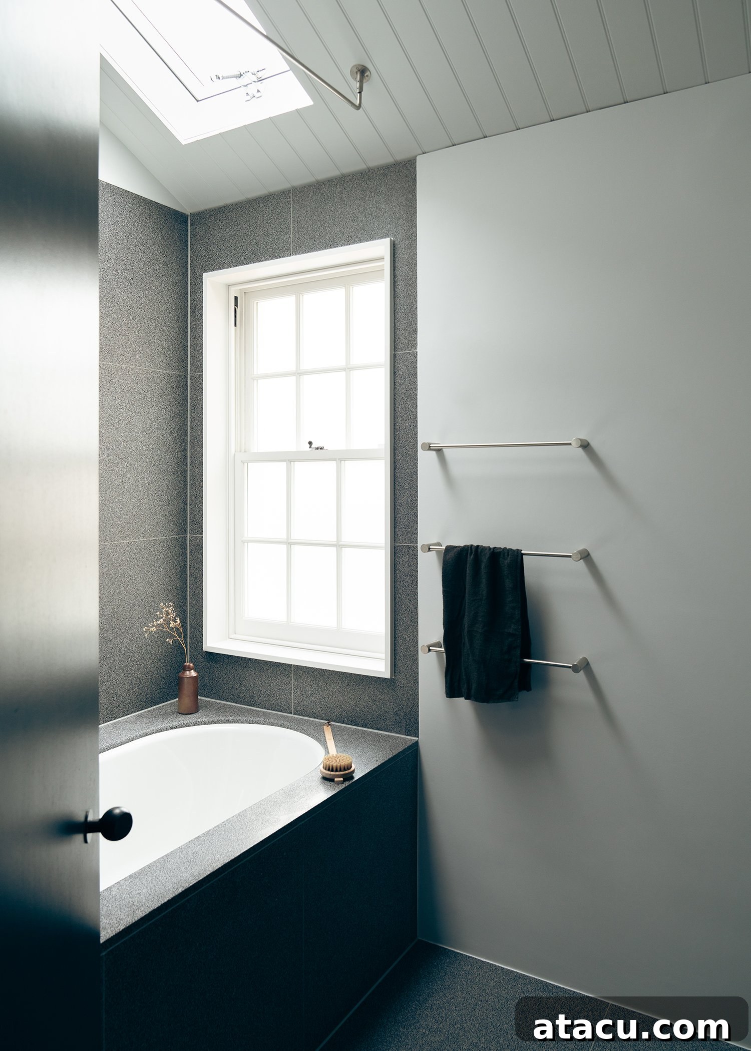 Elegant grey tiled bathroom with modern fixtures