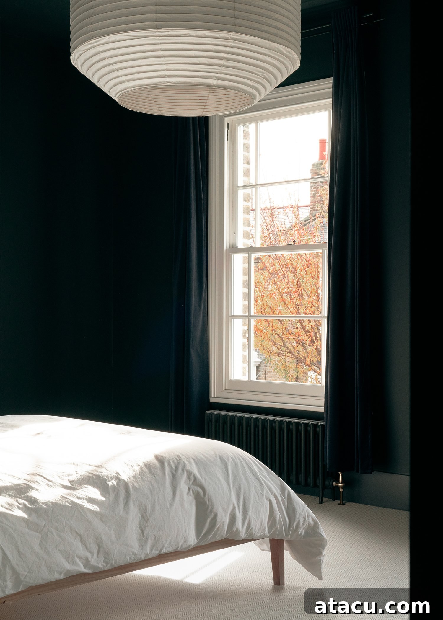 Detail of a dark wall in an upper floor room, emphasizing the contrasting palette