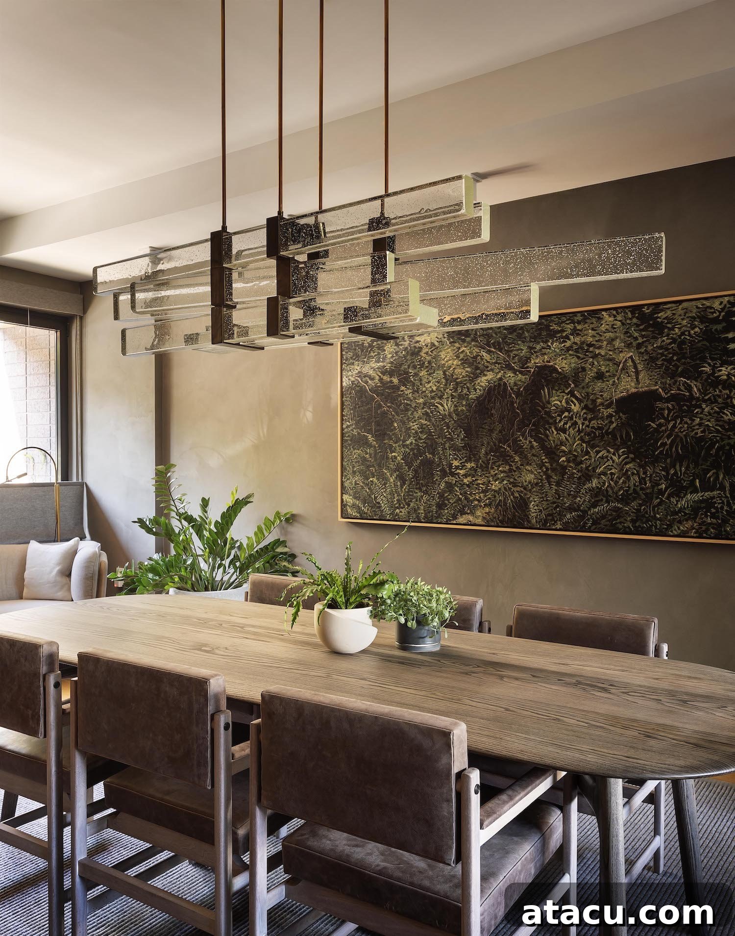 Another view of the sophisticated dining room, emphasizing its spaciousness and natural materials.