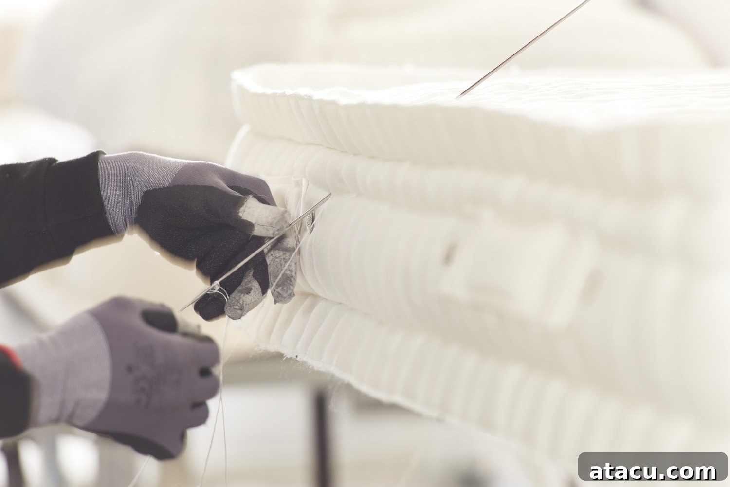 A beautifully made Feather & Black Bronte mattress in a stylish bedroom setting.