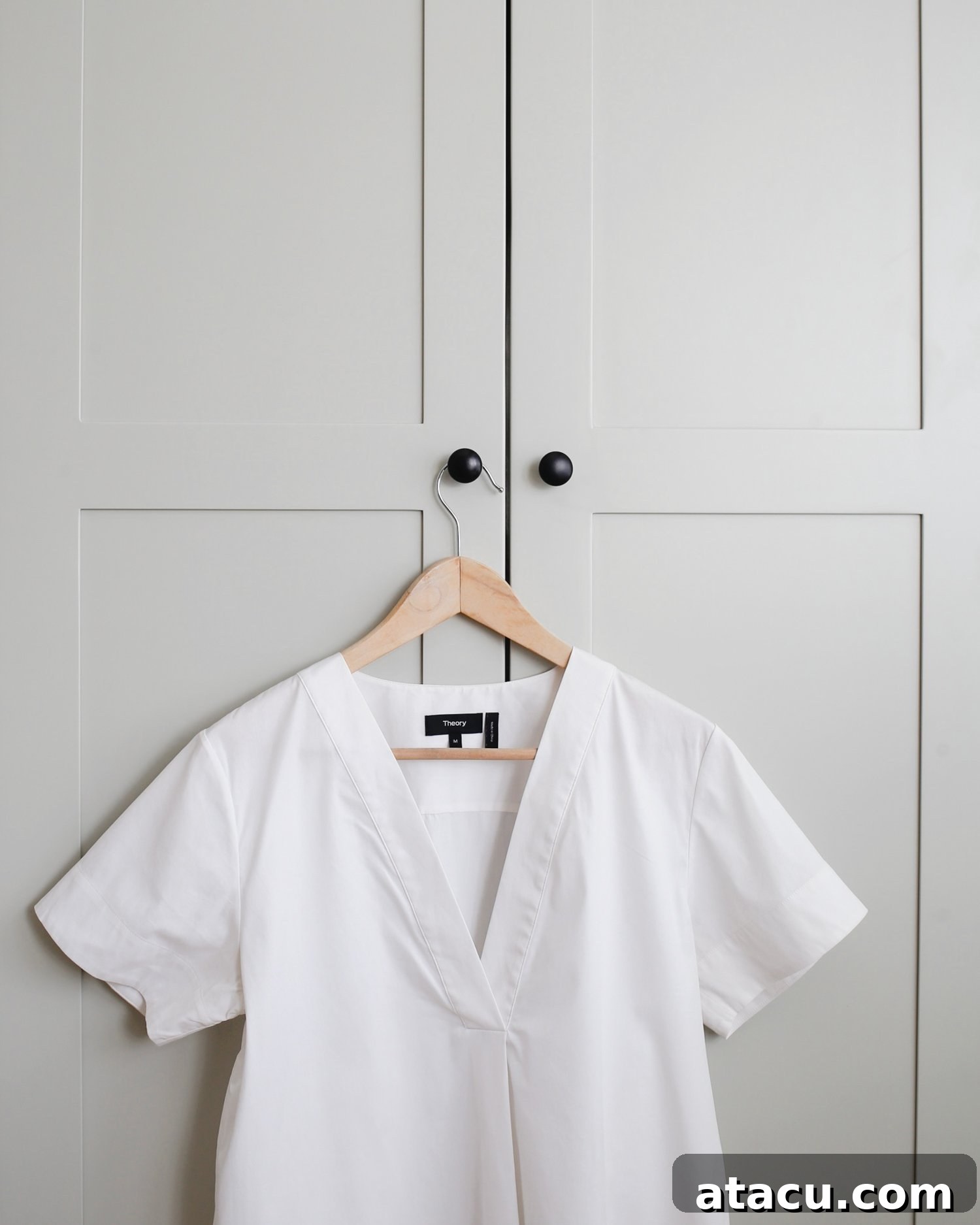 Close-up view of elegant wardrobe handles and the quality finish of custom fitted wardrobes.