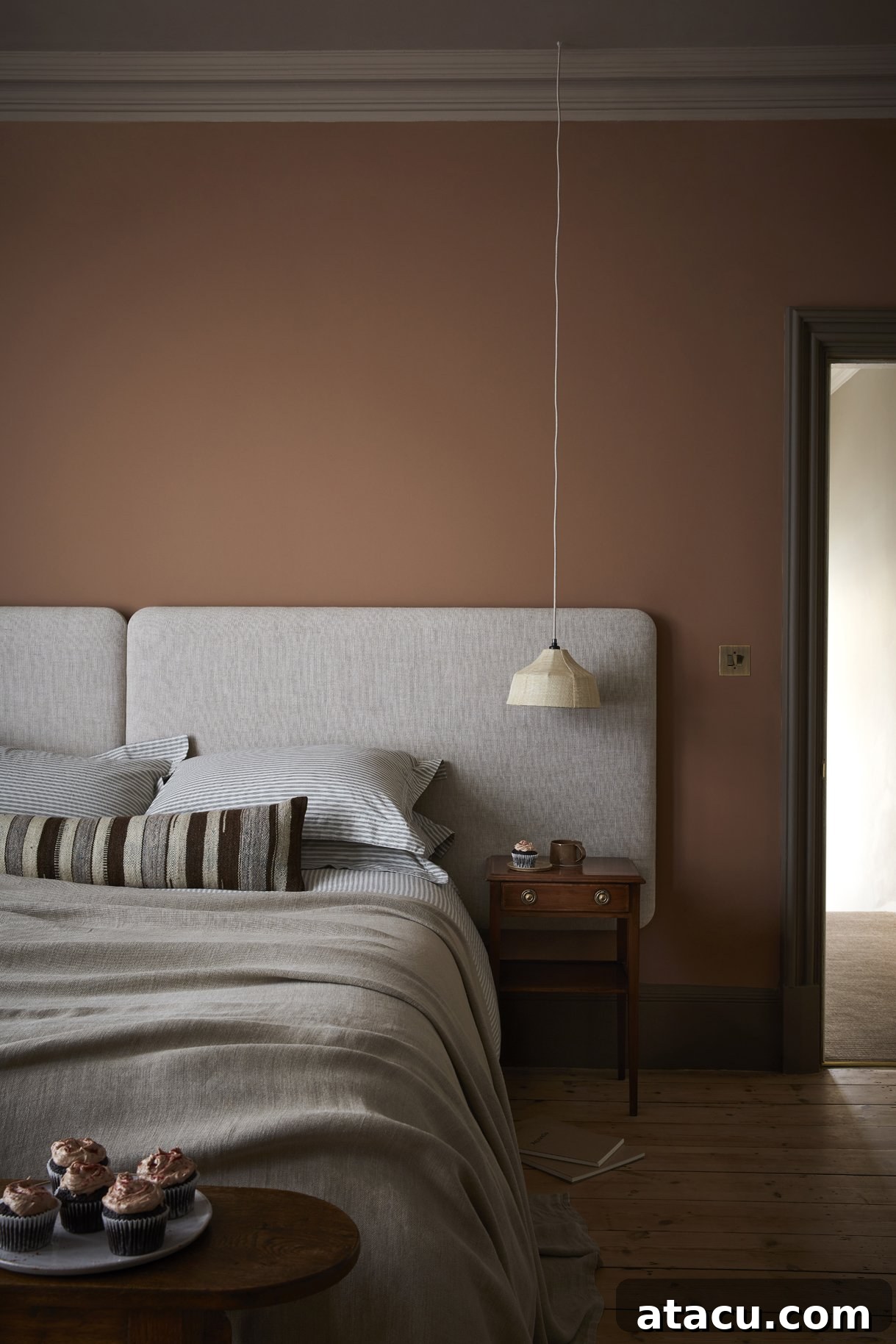 A sophisticated living area showcasing Little Greene Split Pink walls, a muted rose hue, perfectly contrasted with Attic II for skirting and architrave.