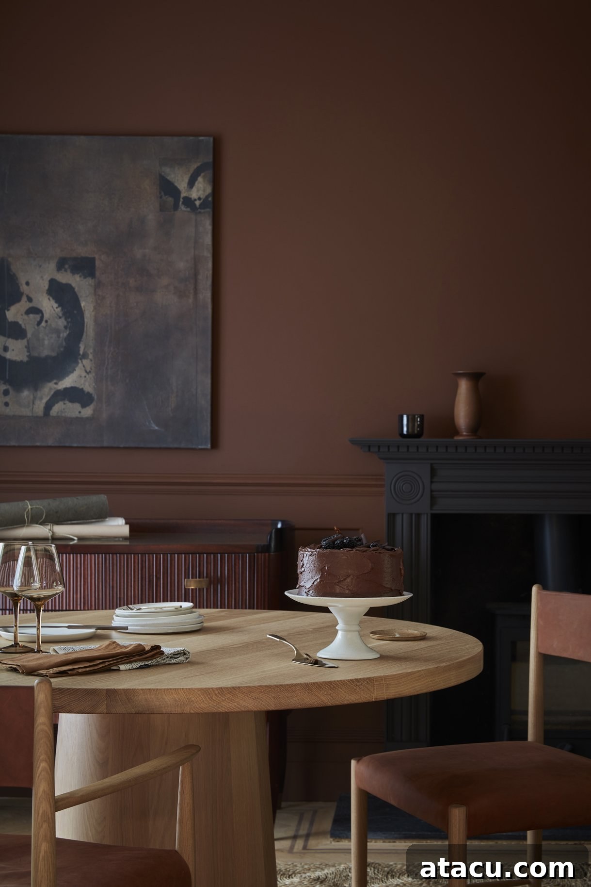 A sophisticated dining room with walls and dado rail painted in Little Greene Ganache, a deep, inviting chocolate tone that creates an intimate atmosphere.