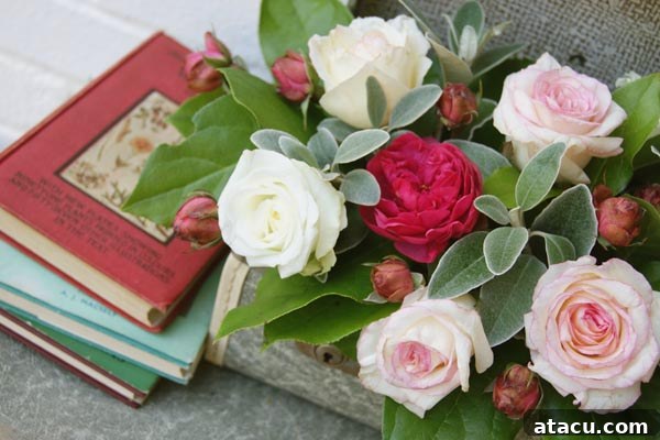 A beautifully composed image featuring two vintage suitcases, one open with a lush floral arrangement spilling out, next to a closed companion suitcase, creating an inviting and romantic scene.