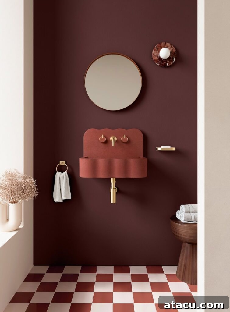 A contemporary Kast concrete coloured washbasin in a striking brick red, embodying modern design and color.