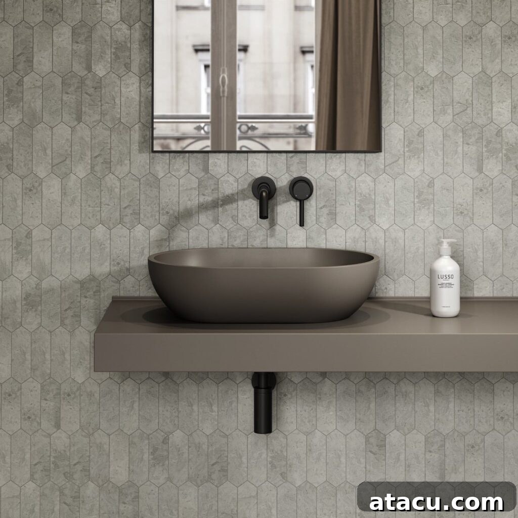 A modern grey countertop washbasin, demonstrating minimalist design with subtle color.