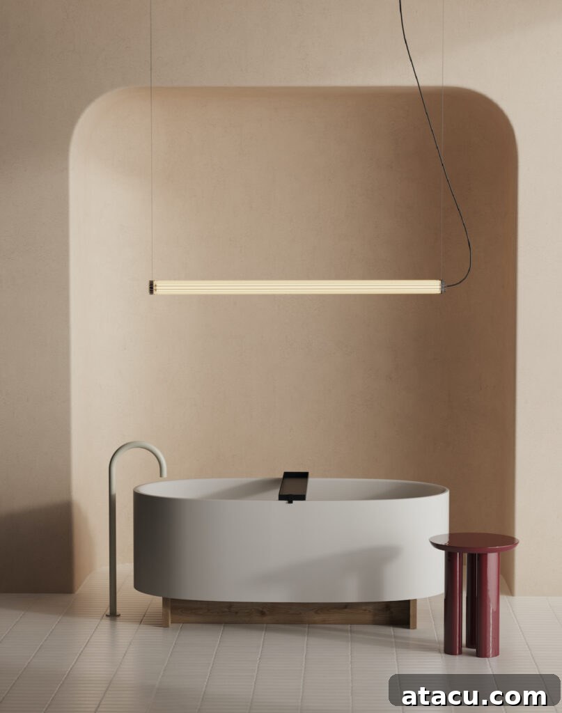 A chic grey modern freestanding bath positioned elegantly in a minimalist bathroom setting.
