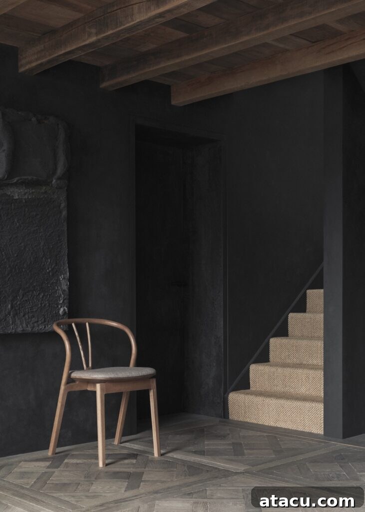 L. Ercolani flow chair in a beamed hallway