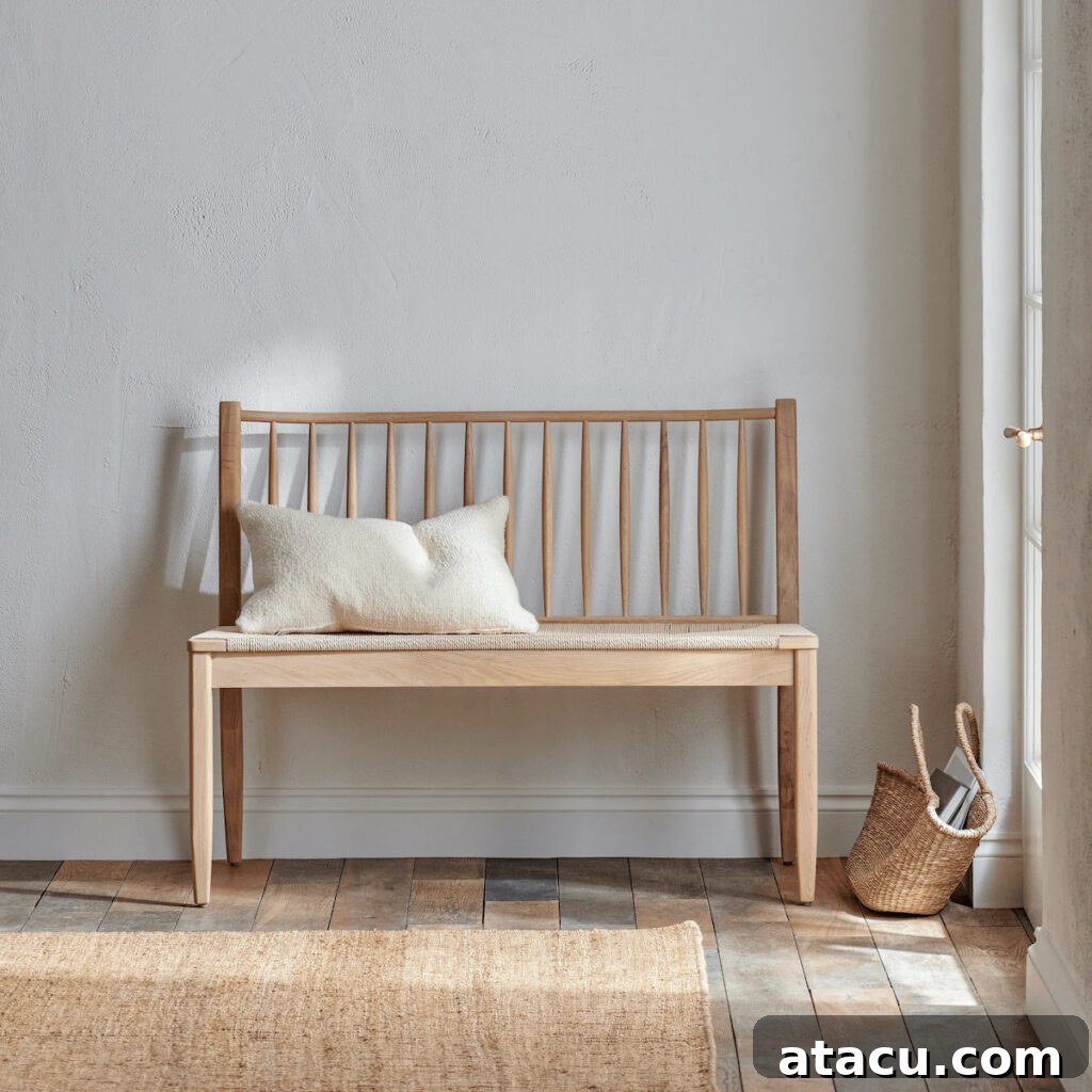 High back wooden bench in a light modern hallway.