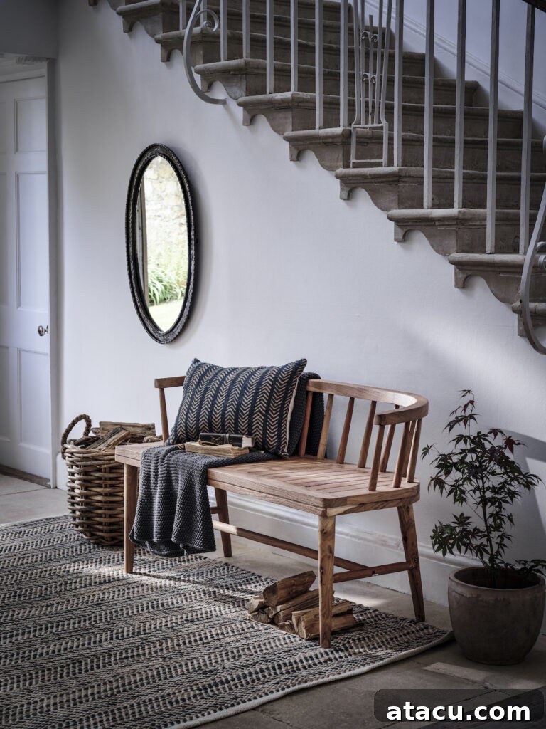 An elegant hallway with a wooden bench.