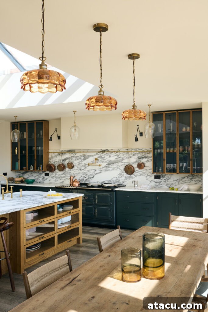21 Jaw-Dropping Kitchen Extension Designs 15 A stylish row of elegant pendant lights illuminating a modern kitchen, serving as a stunning focal point.