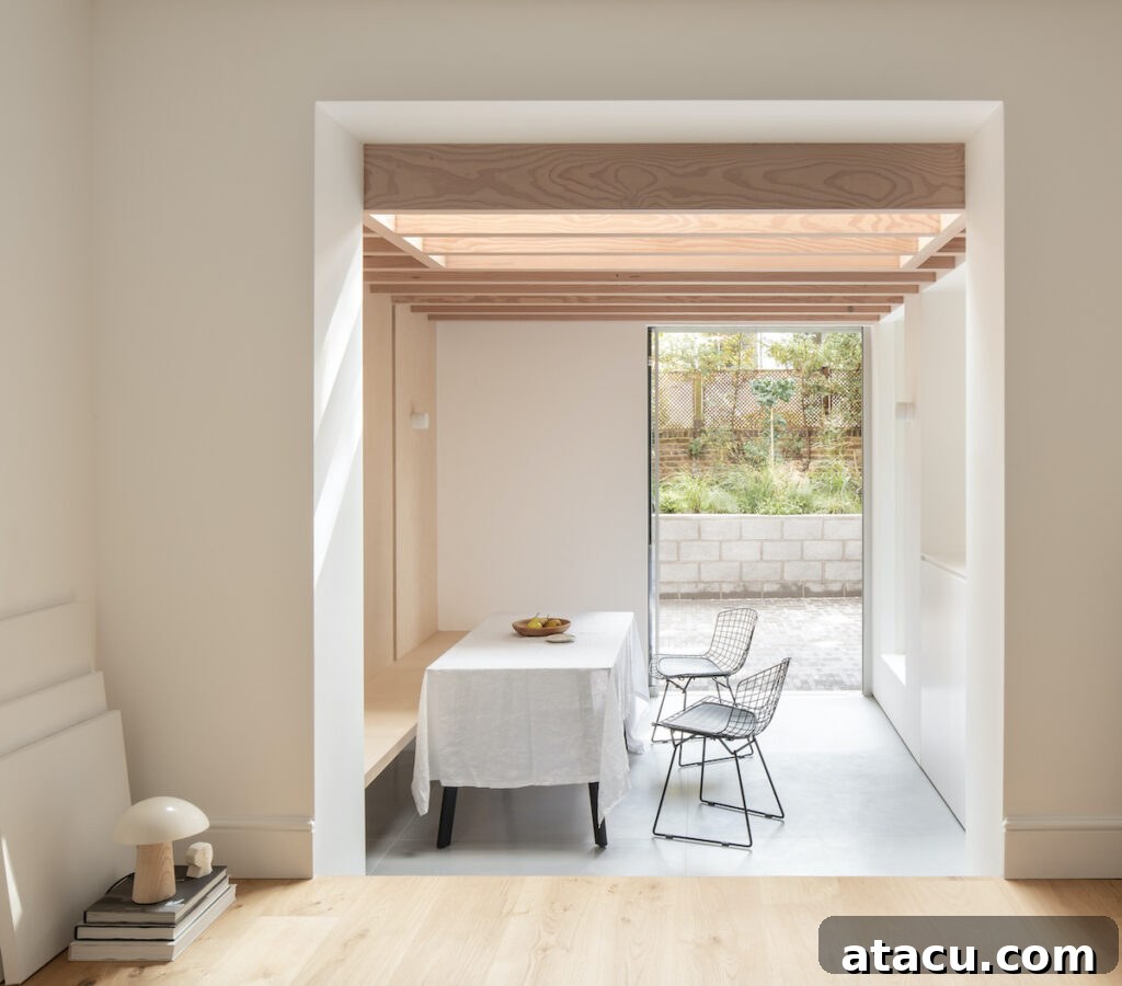 21 Jaw-Dropping Kitchen Extension Designs 19 A light-filled modern kitchen extension accented with elegant contemporary wooden ceiling beams.