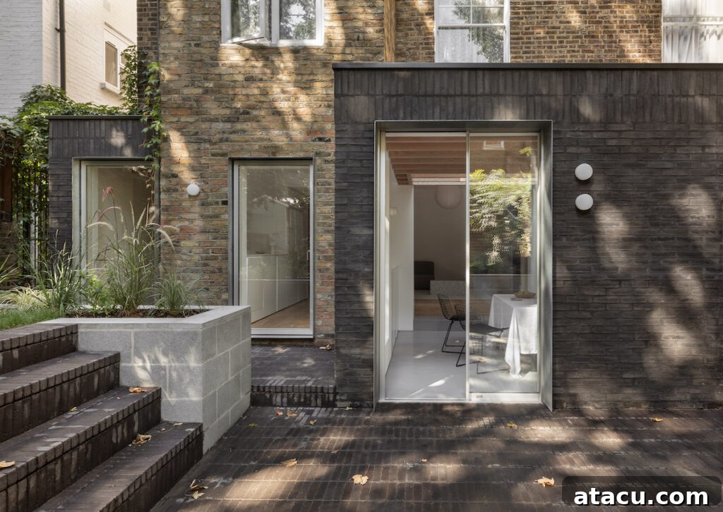 21 Jaw-Dropping Kitchen Extension Designs 10 A striking kitchen extension featuring contrasting brickwork, blending traditional charm with a modern design aesthetic.