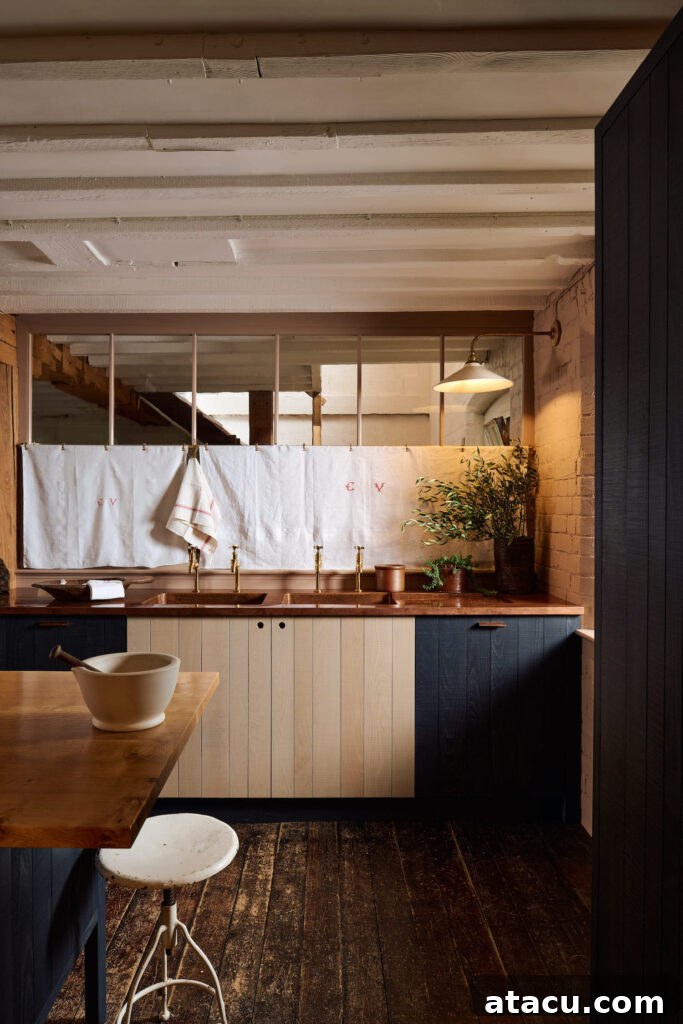Luxurious copper worktops in a modern rustic kitchen by Sebastian Cox for deVOL, highlighting elegant design.