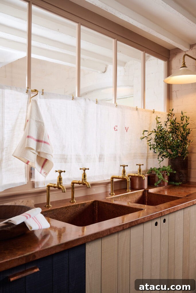 Custom copper kitchen worktops with an integral sink, showcasing artisanal craftsmanship.