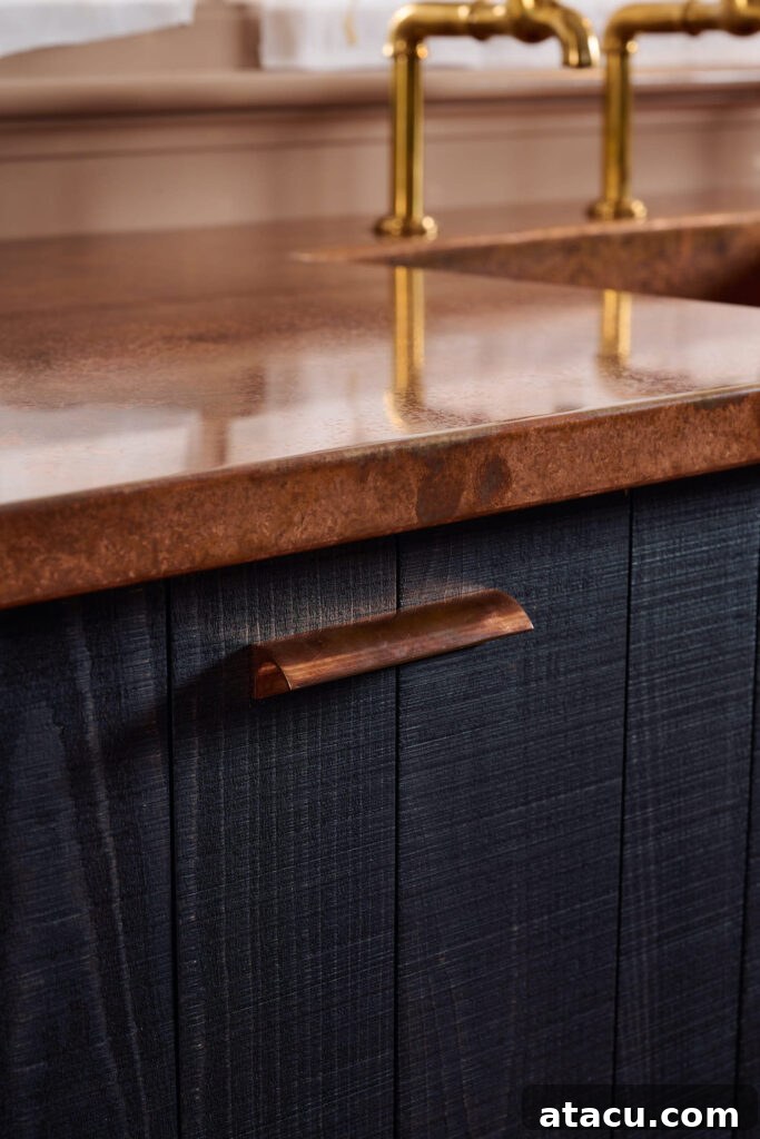 A kitchen featuring bespoke copper worktops, highlighting the material's evolving patina.