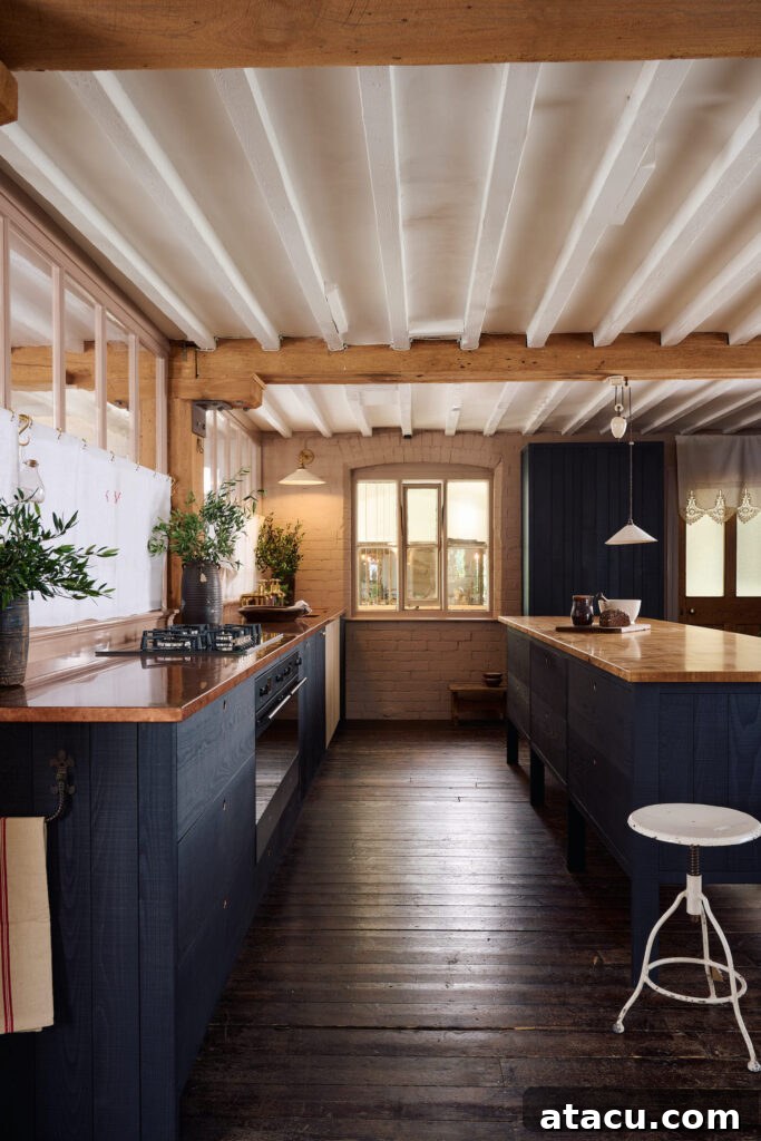 Detailed view of copper worktops in a modern rustic kitchen by Sebastian Cox for deVOL, emphasizing texture.