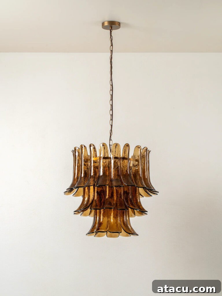 Transform Your Hallways: Inspiring Lighting Ideas for a Radiant Home 2 Aged brass and smoked brown glass chandelier by Lights and Lamps, a stunning focal point for a grand hallway.