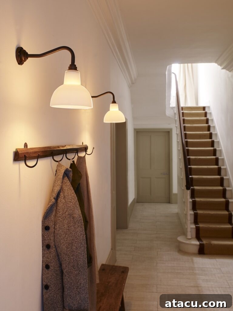 Transform Your Hallways: Inspiring Lighting Ideas for a Radiant Home 10 An opal glass wall light in a light spacious hallway, creating a soft, diffused glow for an elegant ambiance.
