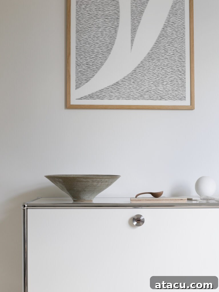 Modern office with Farrow and Ball Strong White walls paired with USM Haller cabinet