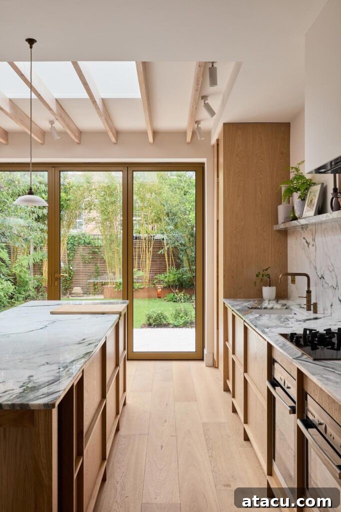 A wide shot of the elegant Scandinavian kitchen in a Victorian townhouse.