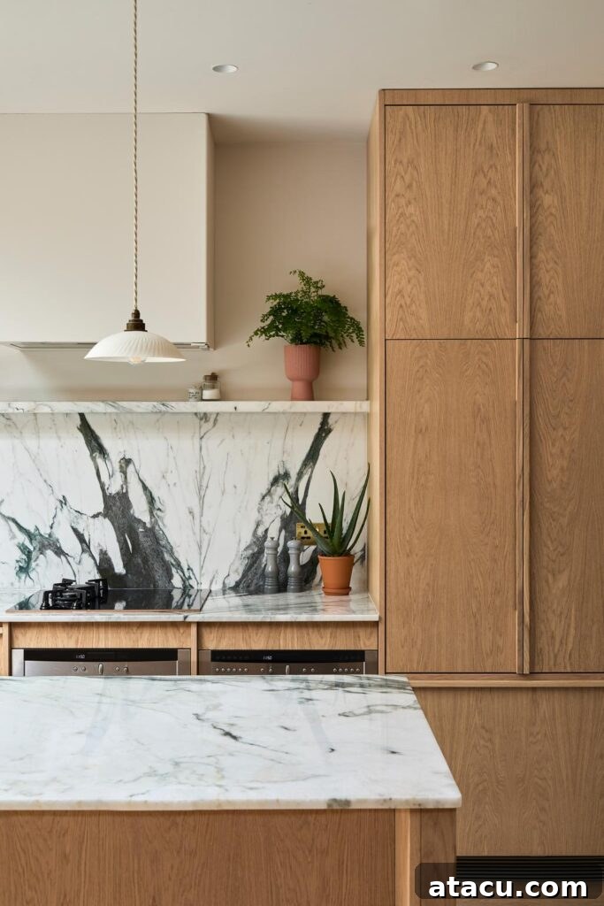 The integrated dining area in the Scandinavian kitchen, showing built-in storage.