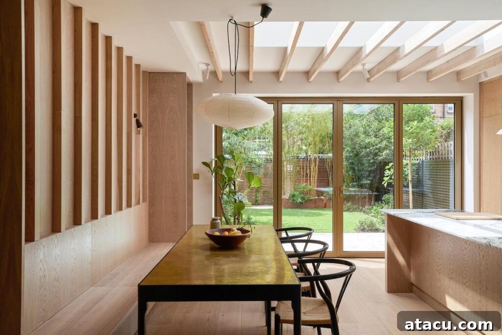 Overview of the kitchen and dining area, demonstrating the seamless flow of space.