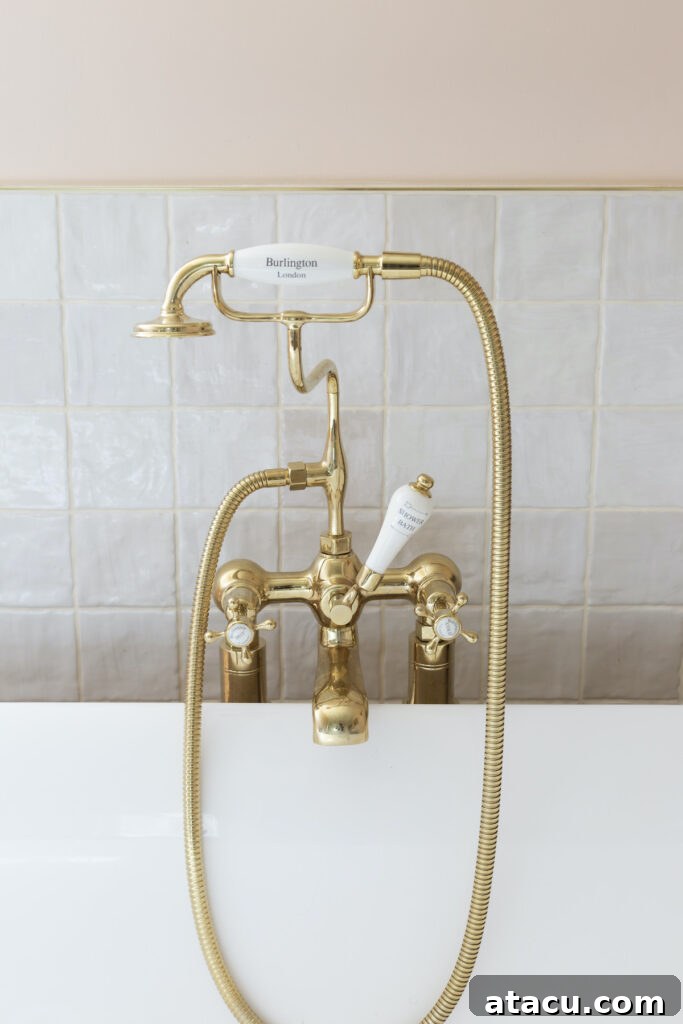 Glossy white Safi seashell effect tiles reflecting light beautifully in a small, bright bathroom.