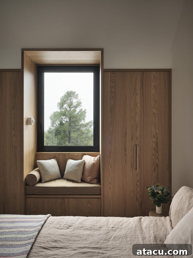 Window seat reading nook in a minimalist bedroom in a contemporary home.