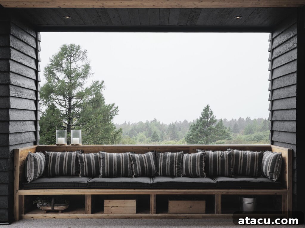 Outdoor bench seating area with Shou Sugi Ban burnt cedar wood walls.