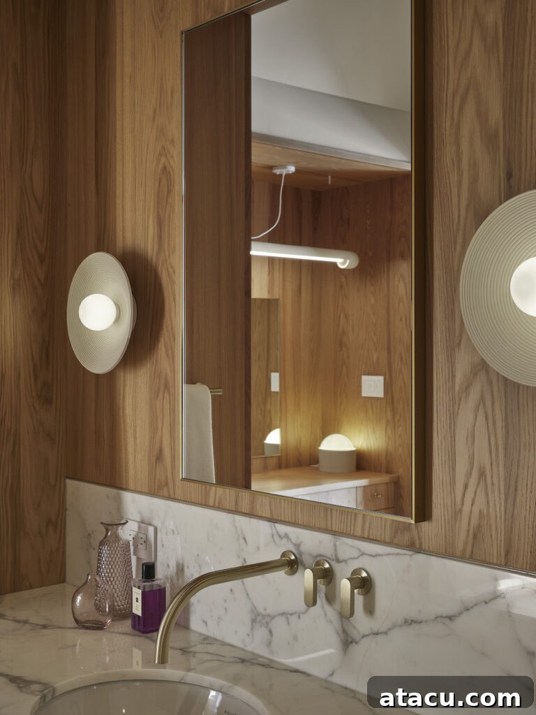 Close up of an oak and marble contemporary bathroom.