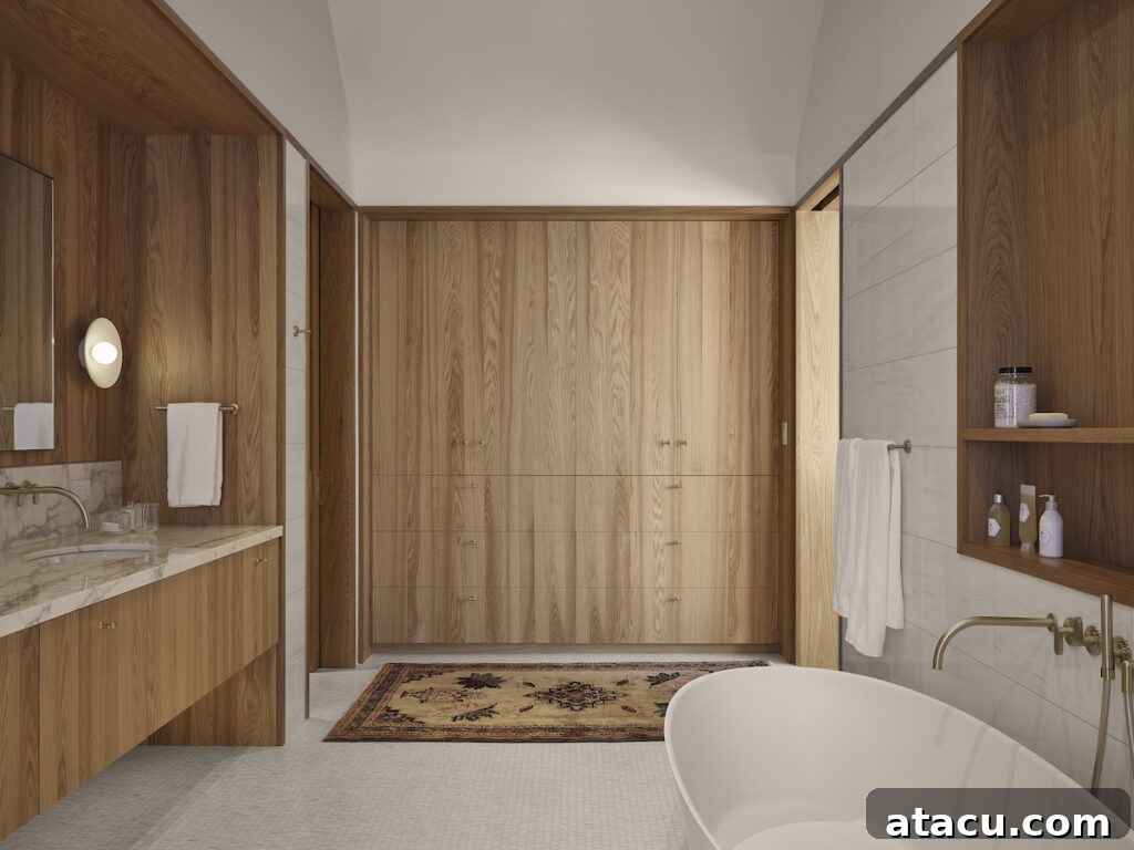 An oak and marble luxury bathroom in a modern home.