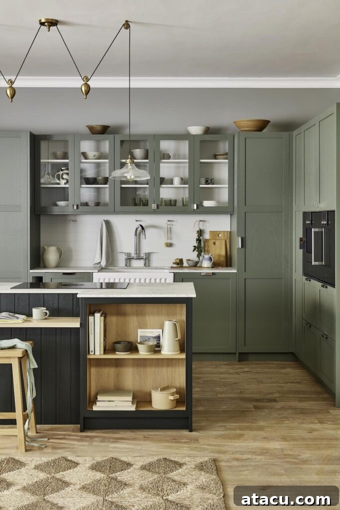 A modern kitchen with sage green cabinets, open shelving, and a farmhouse sink, showcasing sage green kitchen ideas.