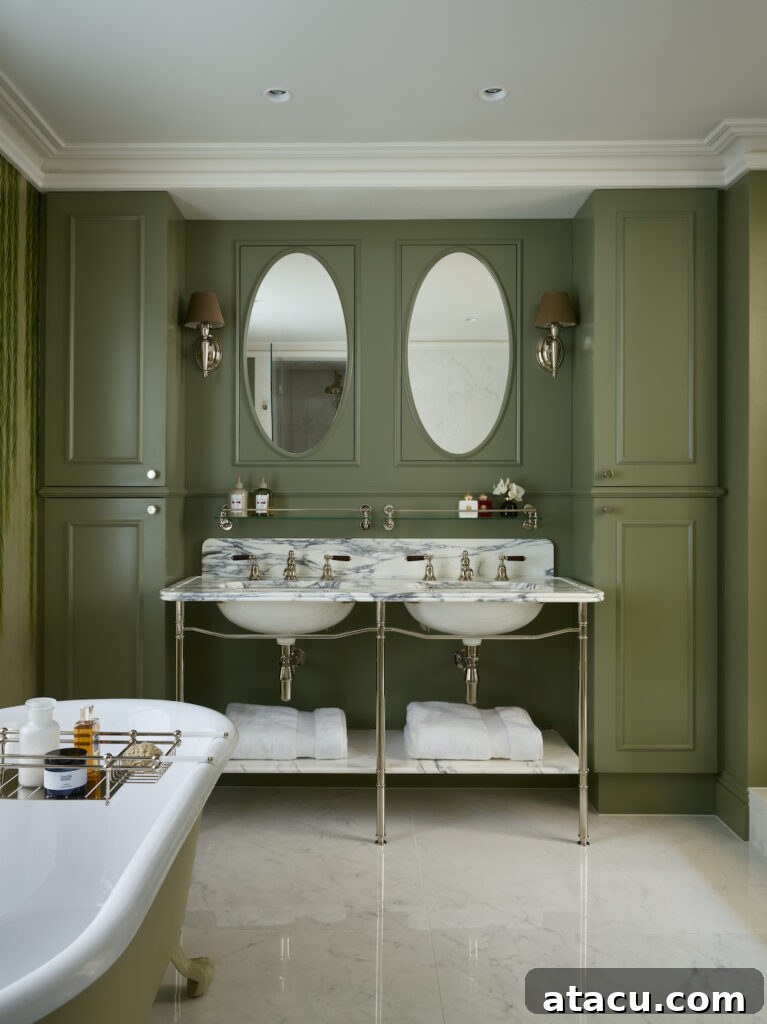 Sage green Victorian style bathroom with freestanding bath tub and double vanity unit, featuring polished nickel fixtures.
