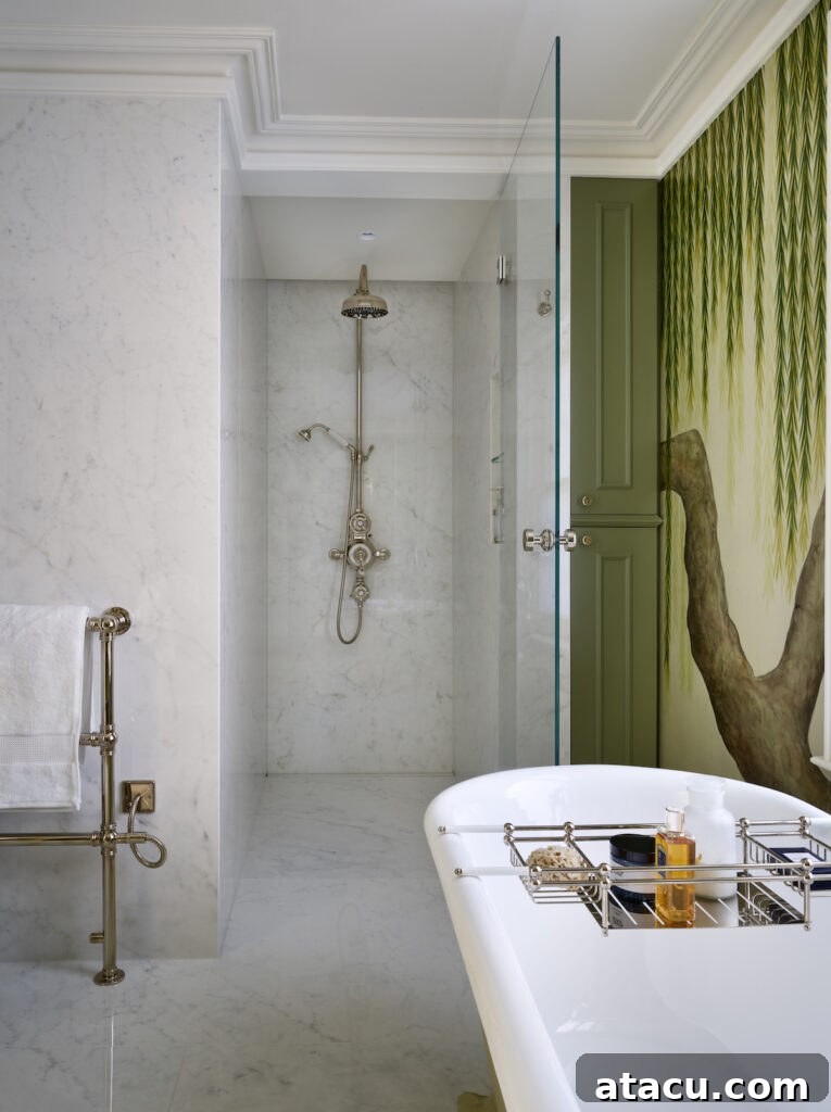 A stunning Victorian style bathroom with a freestanding bath tub, a spacious marble walk-in shower, and refined details.