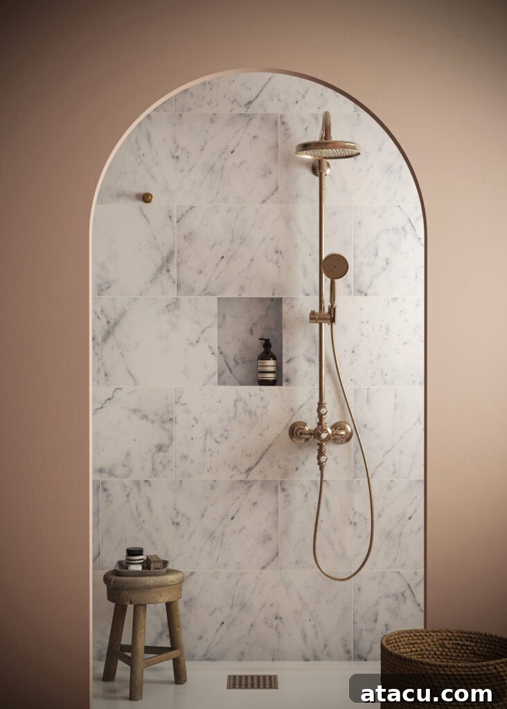 Mocha Mousse bathroom with archway leading to shower area with marble tiles.