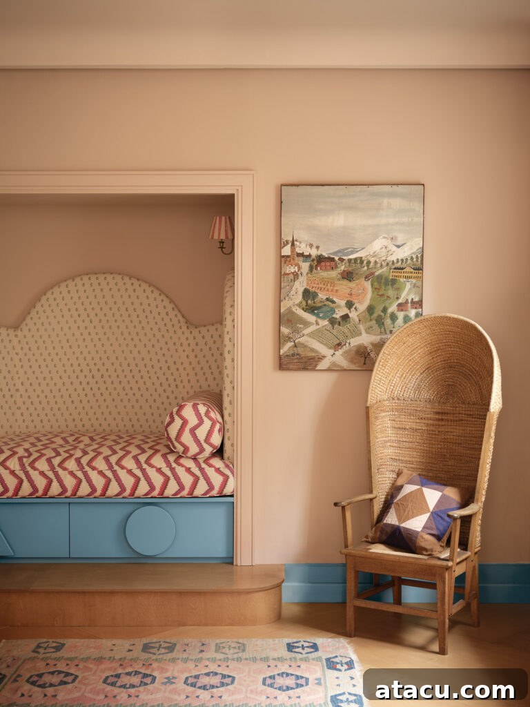 Cozy bed nook with patterned upholstery and a blue base beside a woven high-back chair. The walls are painted in a warm, earthy tone.