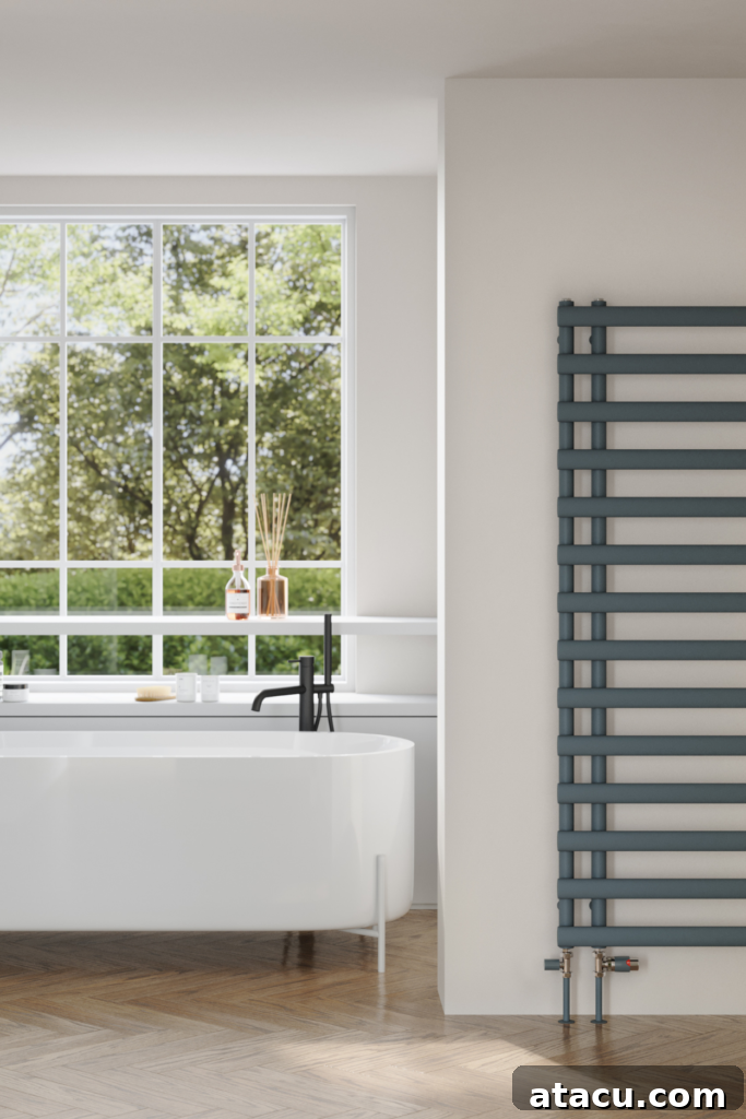 Modern bathroom with a sleek towel radiator and large window, showcasing efficient home heating hacks in style.