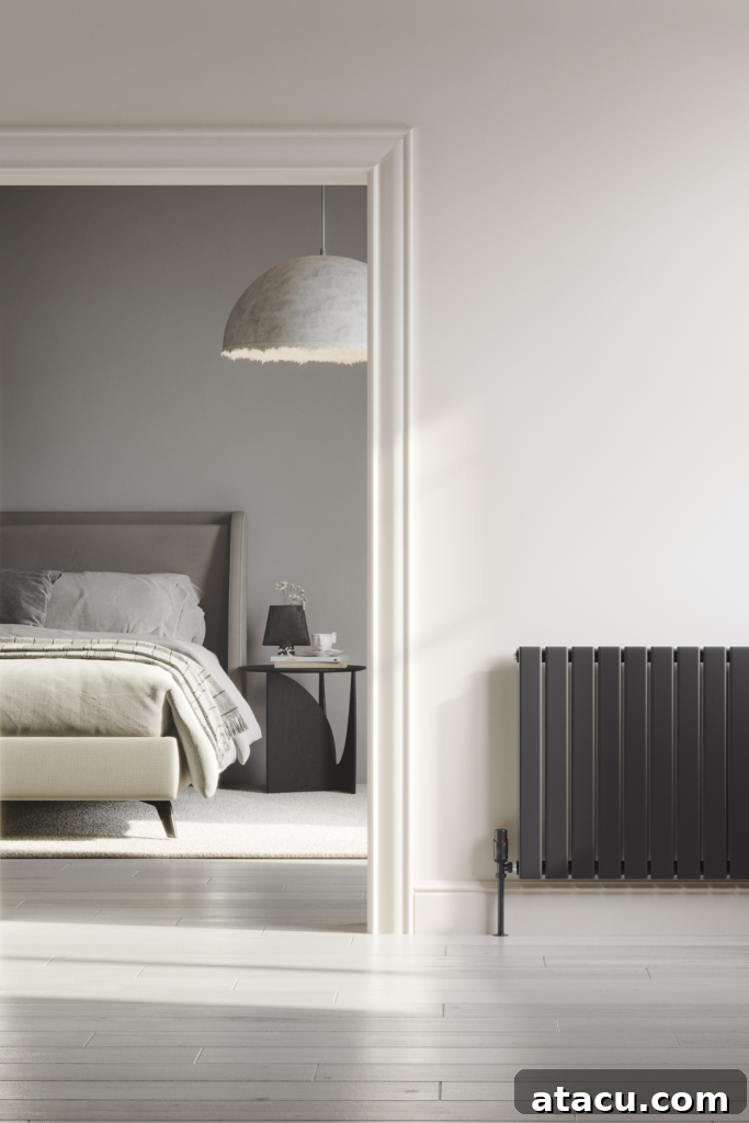 Minimalist bedroom with a sleek black radiator, highlighting stylish and efficient home heating hacks.