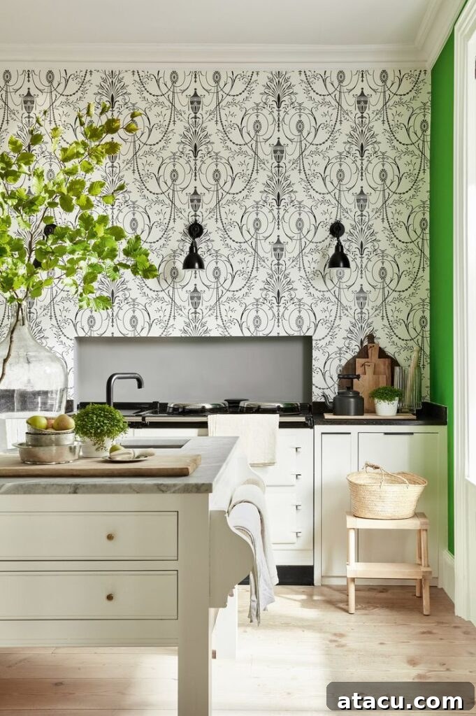 striking black and white wallpaper with intricate neoclassical patterns in a bright, airy kitchen with cream cabinets.