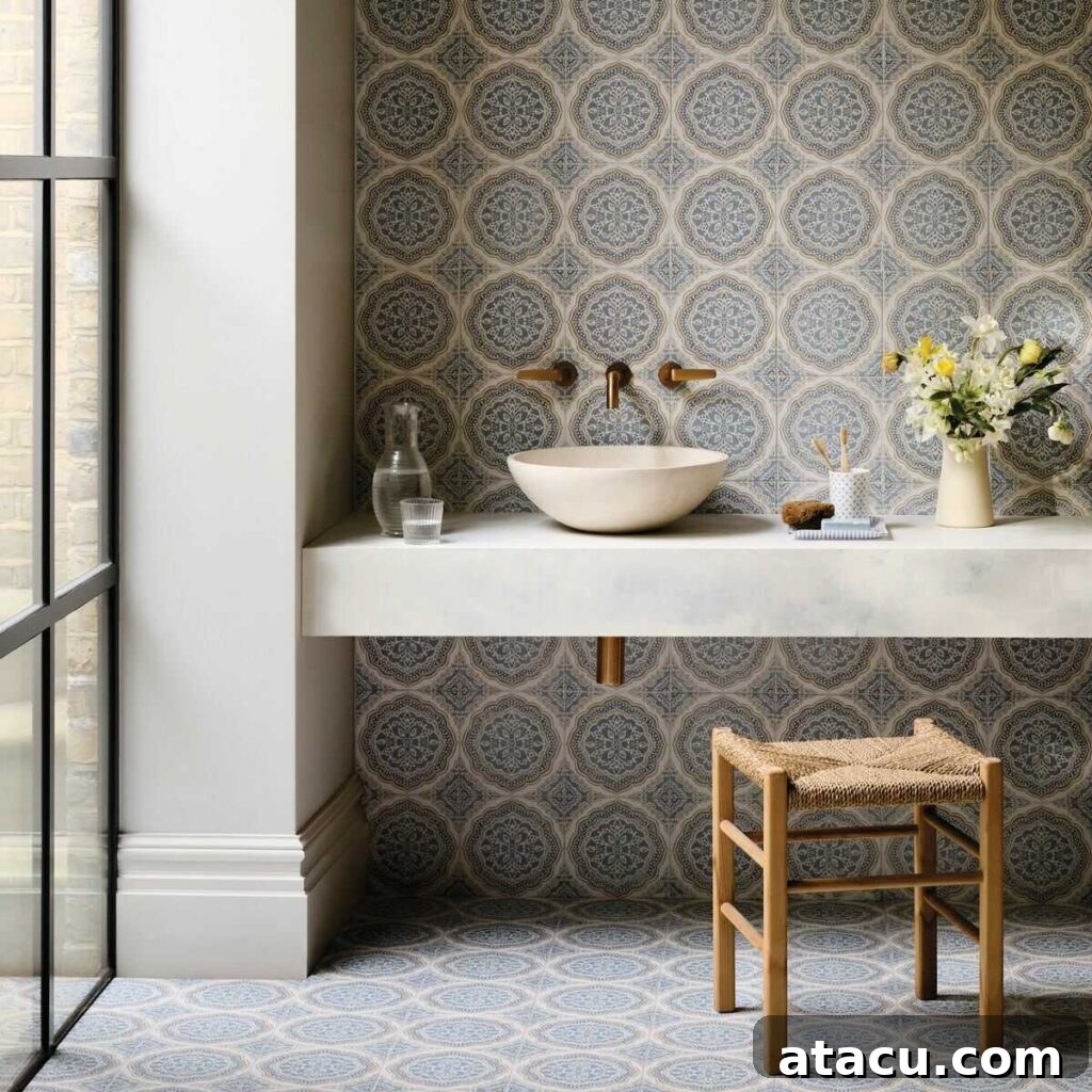 Blue tiled bathroom with tiles by Nina Campbell for FIred Earth.
