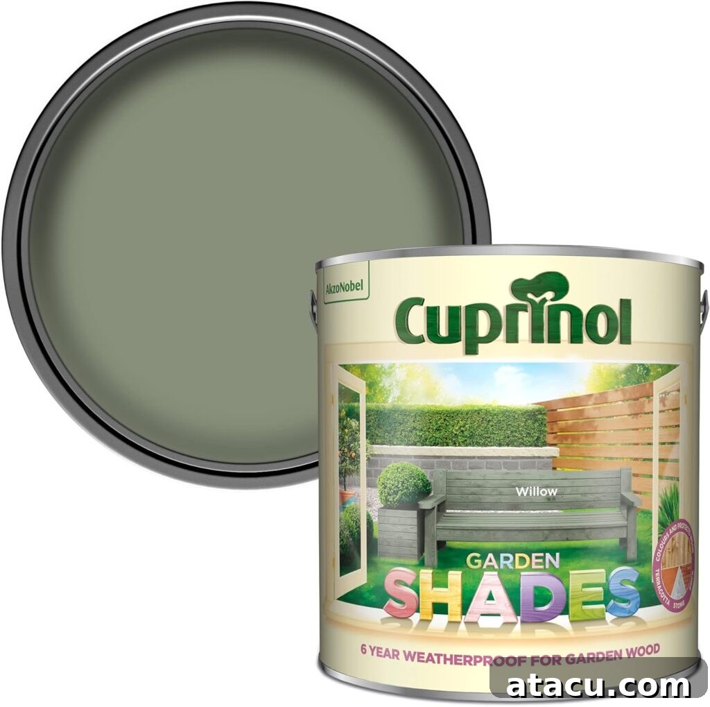 A tin of garden shed and fence paint in soft pale green