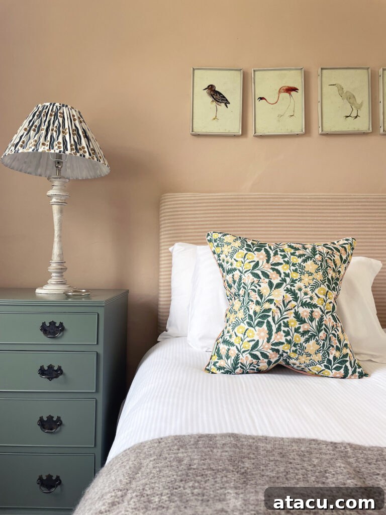 Vibrant floral cushion showcasing a medley of mixed patterns, adding a bold touch to any seating area.