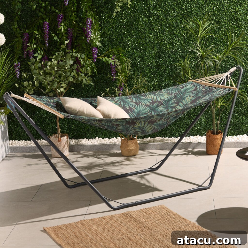 Comfortable palm leaf hammock with a stand, perfect for a relaxing outdoor summer experience.